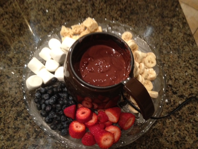 First I made them some chocolate fondue that was a hit with the girls.  And pour of a little of this chocolate over ice cream and we discovered it hardens like an ice cream bar.  Fun! 