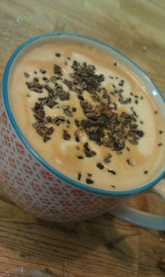 Yummy and eye opening espresso with flax milk, coconut milk espresso, carmel & raw cacao nibs