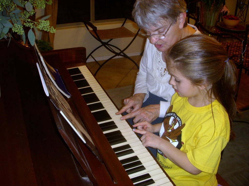 Betty teaches Alexis piano